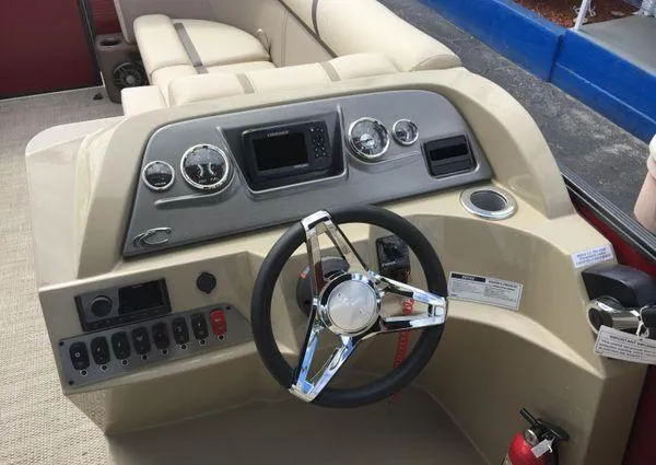Slide: The Image of 2024 Crest LX 220 SLC boat dashboard with steering wheel and control panel. - 17