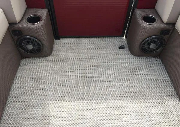 Slide: The Image of 2024 Crest LX 220 SLC boat interior with speakers and cup holders. - 21