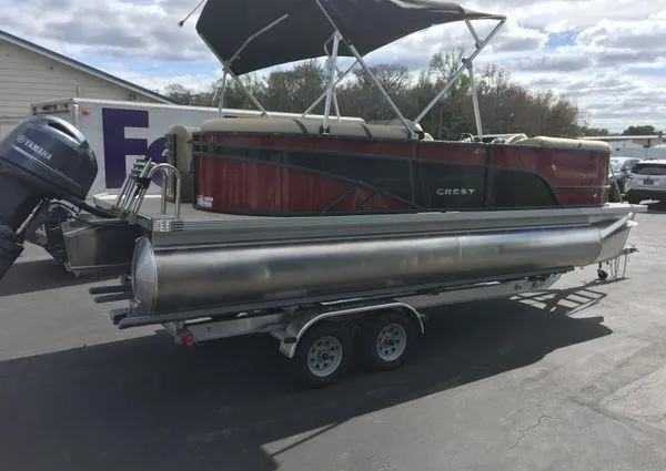 Slide: The Image of 2024 Crest LX 220 SLC pontoon boat on trailer with Yamaha outboard motor. - 7