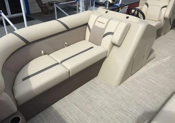 Slide: The Image of 2024 Crest LX 220 SLC boat interior with beige seating and modern design. - 8