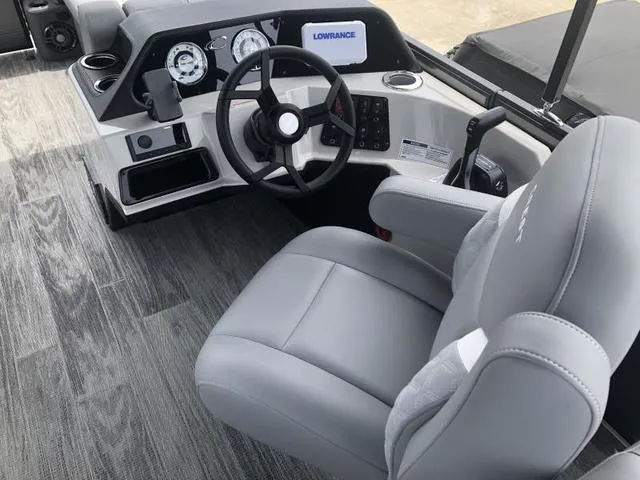 Slide: The Image of Cup holder and speaker in 2025 Crest Classic LX 220 SLRC boat interior. - 10