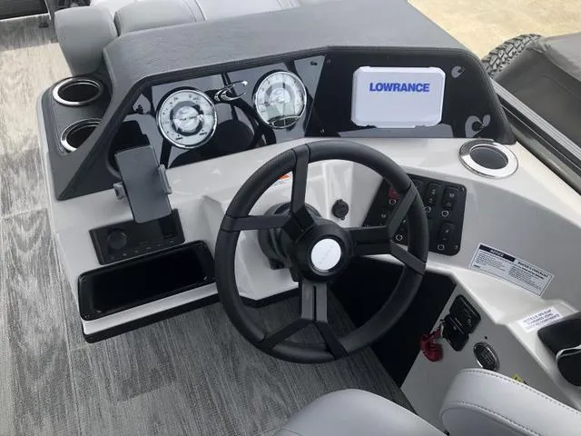 Slide: The Image of 2025 Crest Classic LX 220 SLRC interior with speaker and cup holder detail. - 11