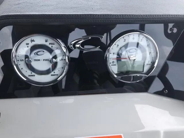 Slide: The Image of 2025 Crest Classic LX 220 SLRC pontoon boat on trailer, featuring sleek design and canopy. - 20