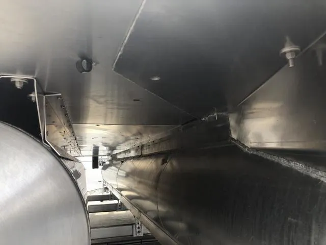 Slide: The Image of 2025 Crest Classic LX 220 SLRC pontoon boat with gray seating and canopy. - 23