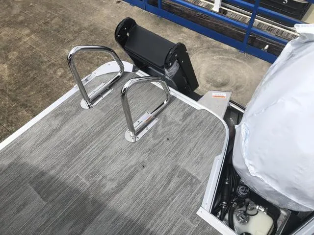 Slide: The Image of 2025 Crest Classic LX 220 SLRC boat interior with gray seating and modern design. - 26