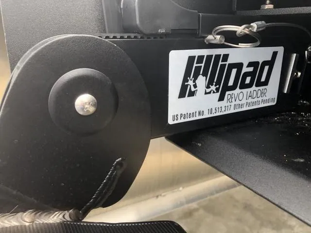 Slide: The Image of 2025 Crest Classic LX 220 SLRC boat dashboard with safety notices and capacity details. - 33