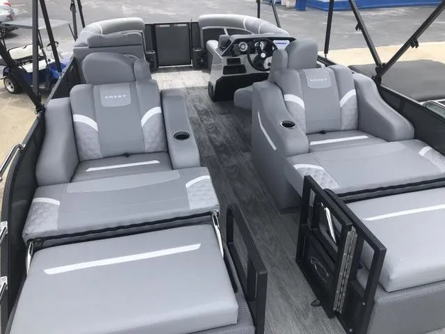 Slide: The Image of 2025 Crest Classic LX 220 SLRC pontoon boat with luxurious gray seating and modern design. - 38