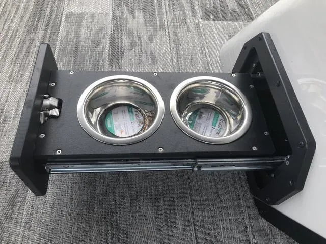 Slide: The Image of 2025 Crest Classic LX 220 SLRC boat interior with gray seating and modern design. - 5