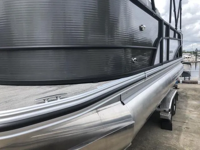 Slide: The Image of 2025 Crest Classic LX 220 SLRC boat interior with steering wheel and control panel. - 8