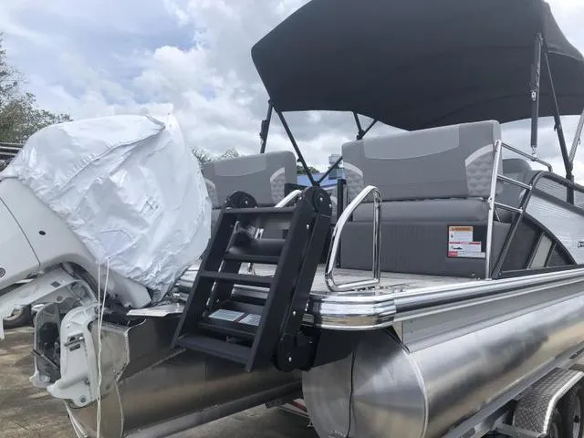 Slide: The Image of 2025 Crest Classic LX 220 SLRC boat dashboard with steering wheel and Lowrance display. - 9