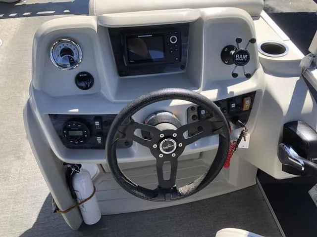 Slide: The Image of Steering console of 2022 SunChaser Vista 188 Sport Fish boat with modern controls and gauges. - 14