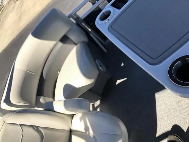 Slide: The Image of 2022 SunChaser Vista 188 Sport Fish boat interior with seating and table. - 16