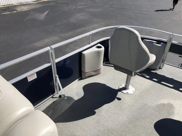 Slide: The Image of 2022 SunChaser Vista 188 Sport Fish boat interior with seating and railing. - 21