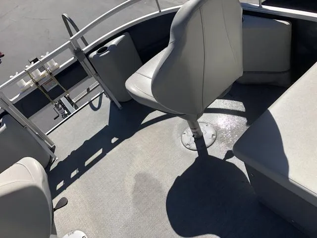 Slide: The Image of 2022 SunChaser Vista 188 Sport Fish boat interior with seating and railing. - 22