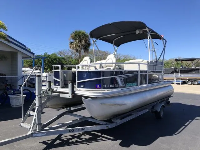 Slide: The Image of 2022 SunChaser Vista 188 Sport Fish pontoon boat on trailer, parked outdoors. - 3