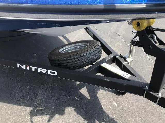 Slide: The Image of Trailer of 2021 Nitro Z19 Sport boat with spare tire on asphalt. - 16