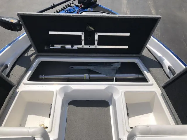 Slide: The Image of 2021 Nitro Z19 Sport boat storage compartments open, revealing interior space and equipment. - 27