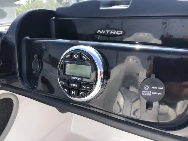 Slide: The Image of Dashboard of a 2021 Nitro Z19 Sport boat with audio controls and inputs. - 31