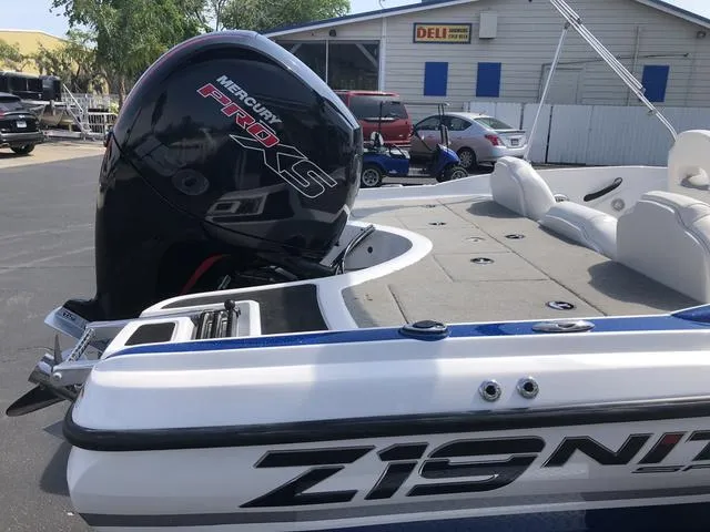 Slide: The Image of 2021 Nitro Z19 Sport boat with Mercury Pro XS engine in a parking lot. - 9