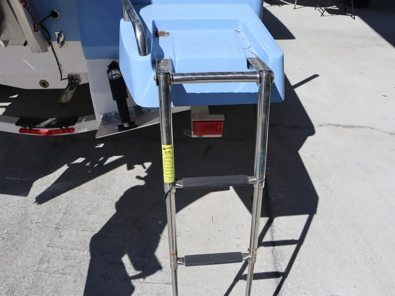 Slide: The Image of 2023 Robalo 226 Cayman boat with a stainless steel boarding ladder. - 14