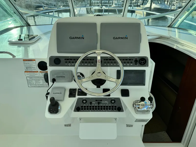 Slide: The Image of Helm of 2011 Rampage 34 IPS boat with Garmin navigation displays. - 26