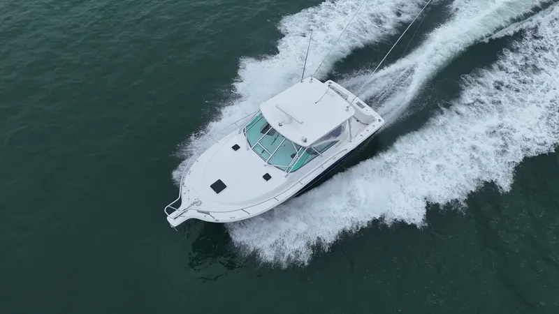 Slide: The Image of Aerial view of 2011 Rampage 34 IPS boat cruising on open water. - 3