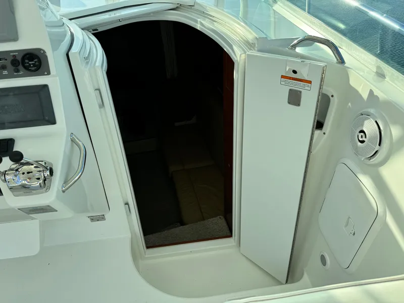 Slide: The Image of 2011 Rampage 34 IPS boat cabin entrance with control panel and speaker. - 35