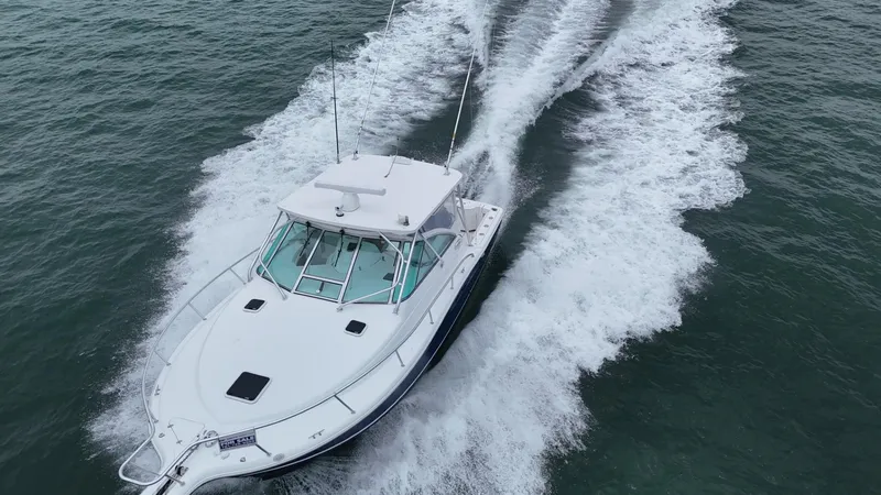 Slide: The Image of Aerial view of 2011 Rampage 34 IPS boat cruising on open water. - 4