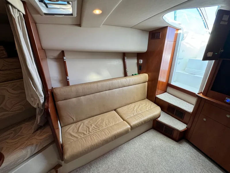 Slide: The Image of Interior of 2011 Rampage 34 IPS yacht with beige seating and wooden accents. - 41