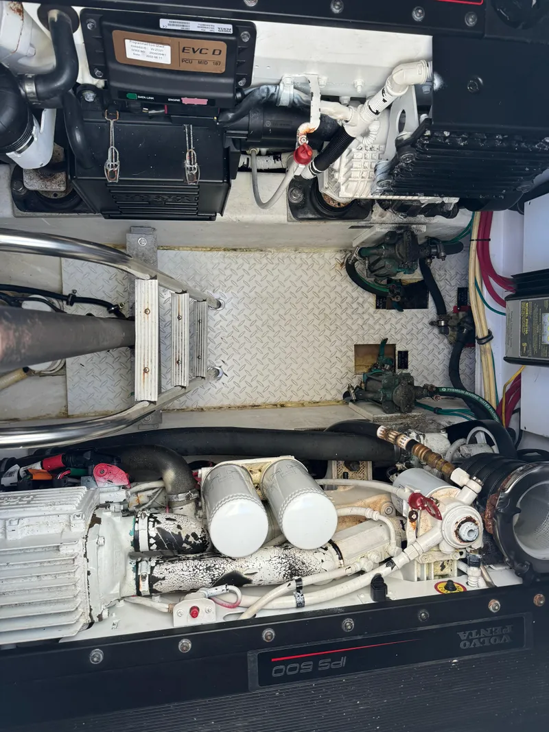 Slide: The Image of Engine compartment of a 2011 Rampage 34 IPS boat, showcasing mechanical components. - 48
