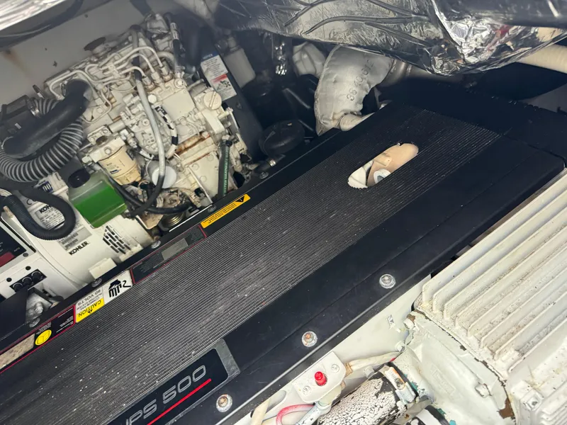 Slide: The Image of Engine compartment of a 2011 Rampage 34 IPS boat, showcasing mechanical components. - 51