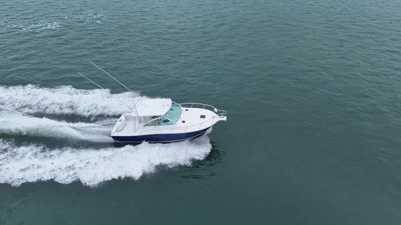 Slide: The Image of Aerial view of a 2011 Rampage 34 IPS boat cruising on open water. - 8