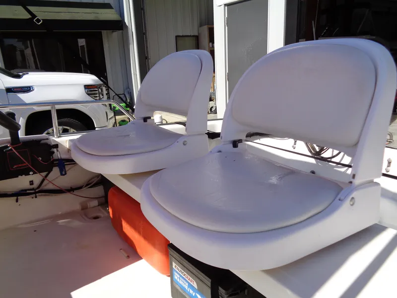 Slide: The Image of 2001 Boston Whaler 13 Sport boat interior with two white seats. - 4