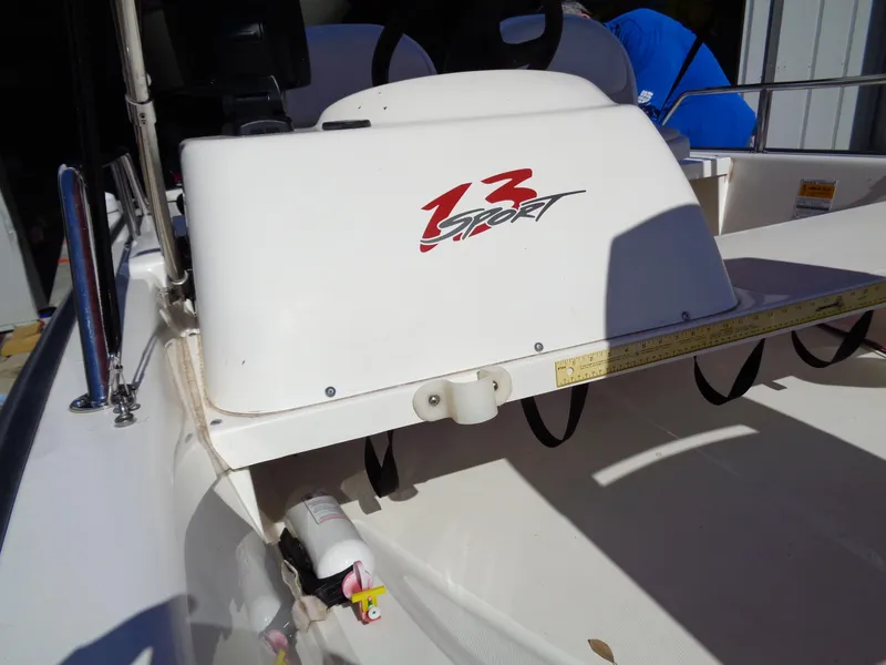 Slide: The Image of 2001 Boston Whaler 13 Sport boat interior with steering console and seating. - 8