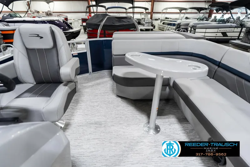 Slide: The Image of 2025 Bennington 23 S CRUISE pontoon boat interior with seating and table. - 17