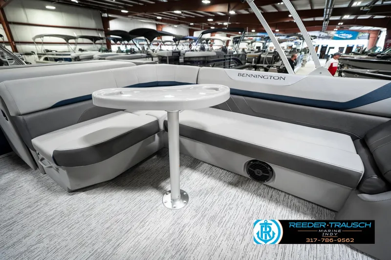 Slide: The Image of 2025 Bennington 23 S Cruise pontoon boat interior with seating and table. - 25
