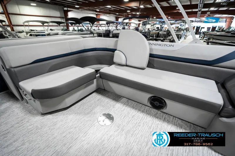 Slide: The Image of 2025 Bennington 23 S CRUISE pontoon boat interior with gray seating in showroom. - 29