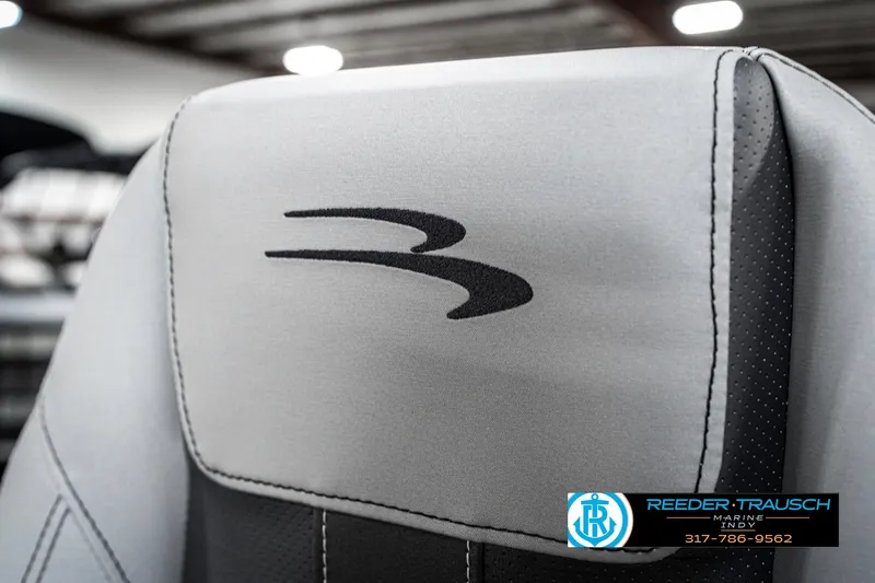 Slide: The Image of 2025 Bennington 23 S CRUISE boat seat with logo, showcased indoors. - 42