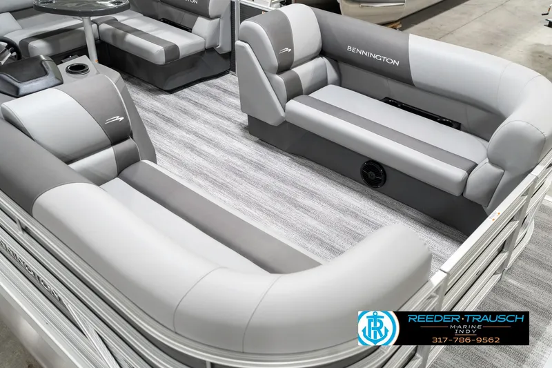 Slide: The Image of 2025 Bennington 21 SS pontoon boat interior with gray seating and carpet flooring. - 13