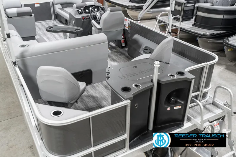 Slide: The Image of 2025 Bennington 21 SS pontoon boat interior with gray seating and modern dashboard. - 15