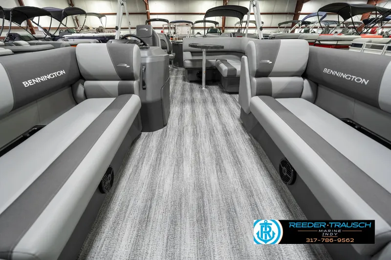 Slide: The Image of 2025 Bennington 21 SS pontoon boat interior with gray seating and carpeted flooring. - 16