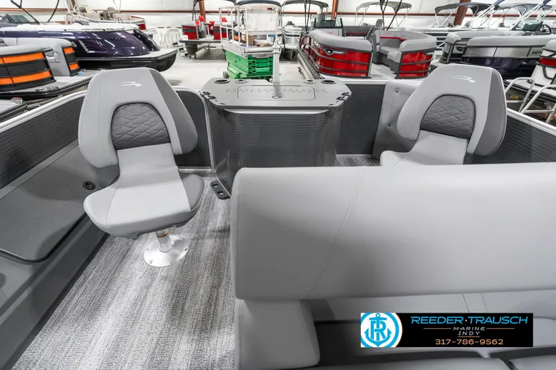 Slide: The Image of 2025 Bennington 21 SS pontoon boat interior with gray seating and modern design. - 18