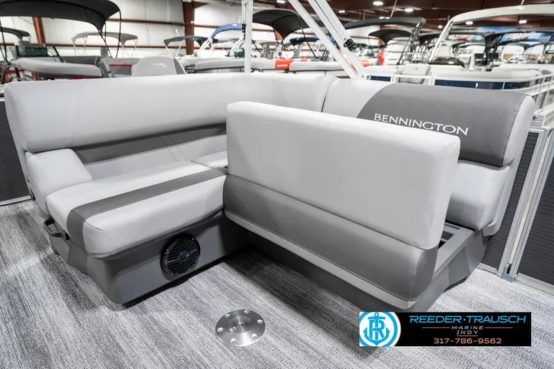 Slide: The Image of 2025 Bennington 21 SS pontoon boat interior with gray seating and logo. - 28