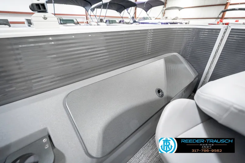 Slide: The Image of 2025 Bennington 21 SS boat interior with sleek gray paneling and seating. - 30