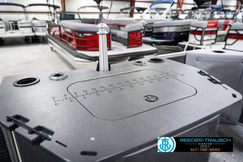 Slide: The Image of 2025 Bennington 21 SS pontoon boat interior with fishing station and cup holders. - 32