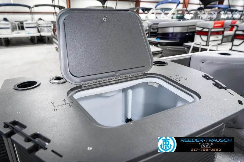 Slide: The Image of 2025 Bennington 21 SS boat storage compartment open in showroom. - 33