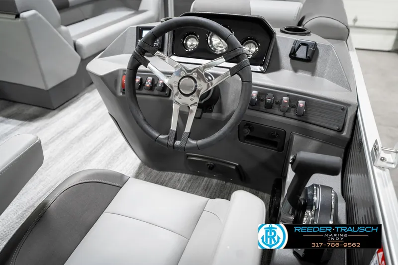 Slide: The Image of 2025 Bennington 21 SS boat interior with steering wheel and dashboard controls. - 34