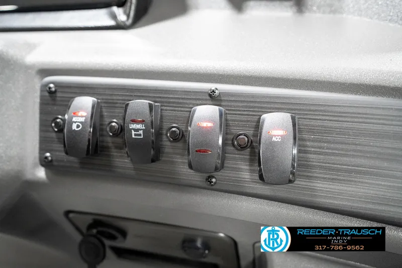 Slide: The Image of Dashboard switches of a 2025 Bennington 21 SS boat, featuring various control options. - 41
