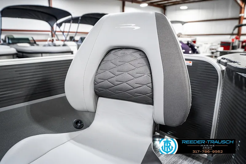 Slide: The Image of 2025 Bennington 21 SS boat seat with modern design in showroom setting. - 44