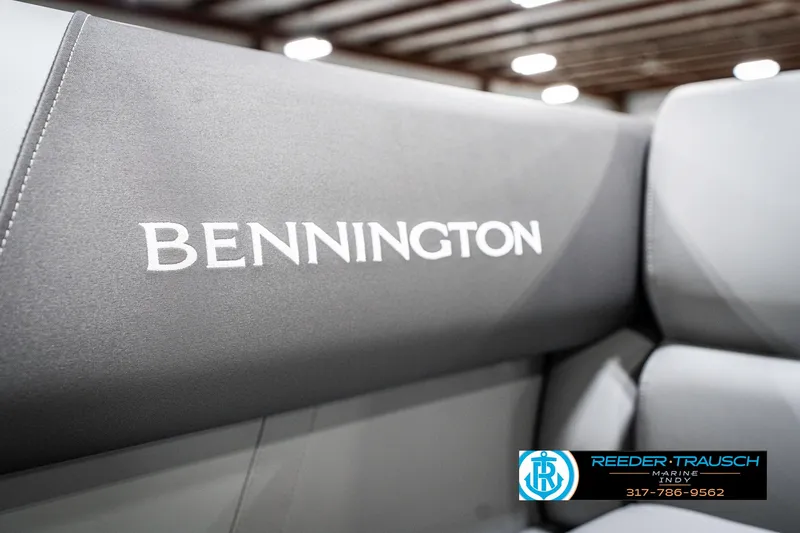 Slide: The Image of 2025 Bennington 21 SS boat interior with branded seating, showcased at Reeder-Trausch Marine. - 46